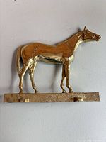Front view of brass horse wall hook key rack
