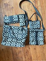 Group shot of tote, crossbody, wallet, wristlet