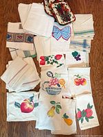 All textiles laid out showing variety of towels, napkins, potholders