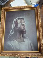 Front view of framed canvas portrait showing image, frame detail, artist signature area