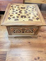 Front left view of marquetry storage chest