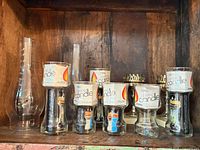 Shelf with five Crystal Candle holders and two hurricane globes