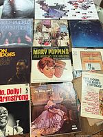 Grid showing 12 LP covers including Mary Poppins, King and I, Deep Purple, etc.