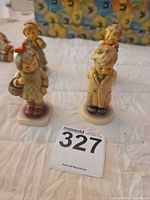 Group shot of four Goebel M.I. Hummel child figurines