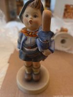 Home From Market figurine front view, boy holding stick