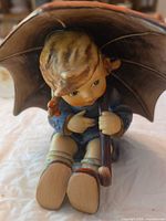 Umbrella Boy figurine front view under umbrella