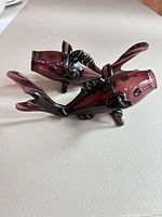 Both amethyst glass koi fish figurines front profile