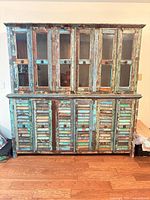 Front view showing full hutch with upper glass doors and lower slatted doors