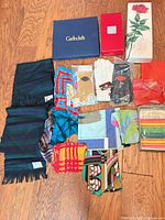Full lot laid out: scarves, gloves, boxes