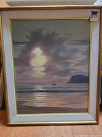 Frontal view of framed seascape oil painting