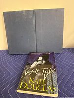 Front view open hardcover and paperback front cover