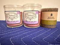 Front view: two Aromabeads Benditarama ‘Blessed’ candles and one Satchel Serafina Golden Sun candle