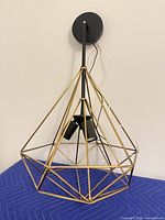 Full view of geometric pendant with canopy and wiring