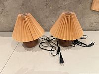 Pair of KNUOULAM table lamps showing full exterior with cords and plugs