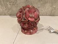 Lamp unplugged showing full spherical floral design and base