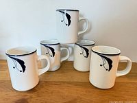 Front view of five matching Dansk Blue & White Flora mugs