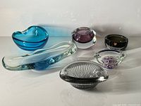 six assorted mid-century art glass bowls and ashtrays arranged for full lot view