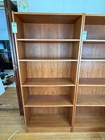front view of teak veneer bookcase with five shelves