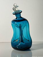Full view of blue Kluk Kluk decanter with stopper
