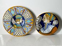 Front view of both Francesca Niccacci for Deruta majolica plates showing designs and condition