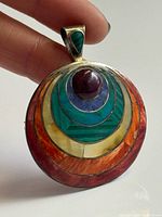 Front view showing multicolour inlay and cabochon