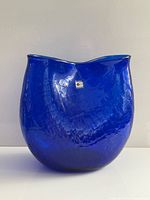 Front view of cobalt blue crackle glass vase with Blenko sticker