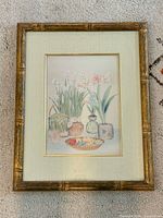 Full view of framed still life print with mat and frame