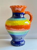 Full view of rainbow striped pottery vase
