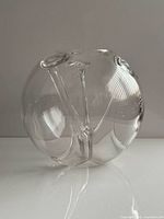 Full view of clear spherical glass bowl-vase showing overall form and clarity