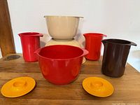 All eight Rosti plastic kitchenware pieces grouped: three bowls, three pitchers, two egg cups