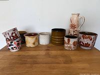 All eight West German planters on tabletop