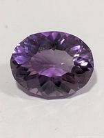 Top view of the oval-cut amethyst showing color and facet pattern