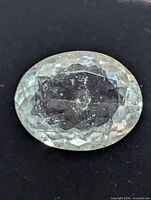 Top view of oval aquamarine showing facets