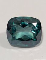 Front view of green cushion-cut topaz
