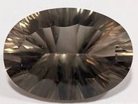 Front view of oval faceted smoky quartz showing transparency and facets