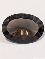 Front view of oval faceted smokey quartz