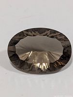 Top view of oval smoky quartz showing crown facets