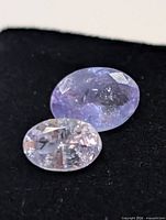 Close-up of two tanzanite stones showing color and faceting