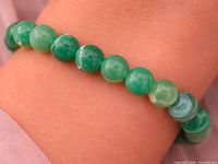 Bracelet worn on wrist showing bead color and fit