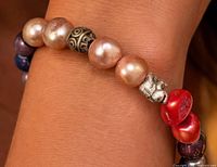 Bracelet worn on wrist showing bead colours and scale