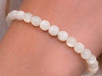 bracelet worn on wrist showing bead color and sheen