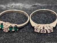 Both rings side by side showing stone colours and settings