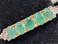 Close-up of emeralds and prong settings