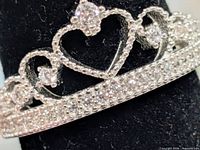 Front view of sterling silver tiara heart ring with CZ stones
