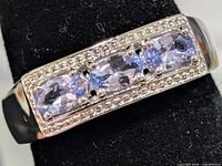 Front view showing tanzanite stones and setting