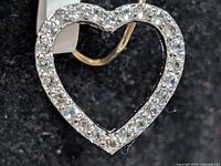 front view of heart pendant showing pavé set stones