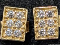 front view of both rectangular silver CZ earrings