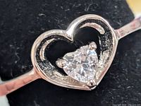 Close-up of heart bezel and cubic zirconia stone