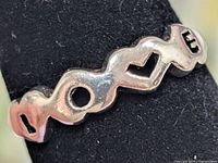 Front view showing LOVE cut-out design on ring