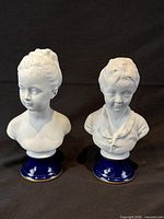 Front view showing both Limoges busts with bases